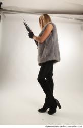 NIKOL STANDING POSE WITH SHOTGUN